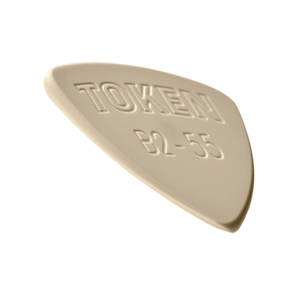 Token B2-55 Small Triangle guitar pick in Tan PEEK, angled view showing precision bevel