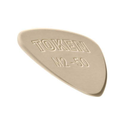 Token M2-50 Large Semi-Round guitar pick in Tan PEEK, angled view showing precision bevel