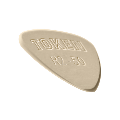 Token R2-50 Small Semi-Round guitar pick in Tan PEEK, angled view showing precision bevel